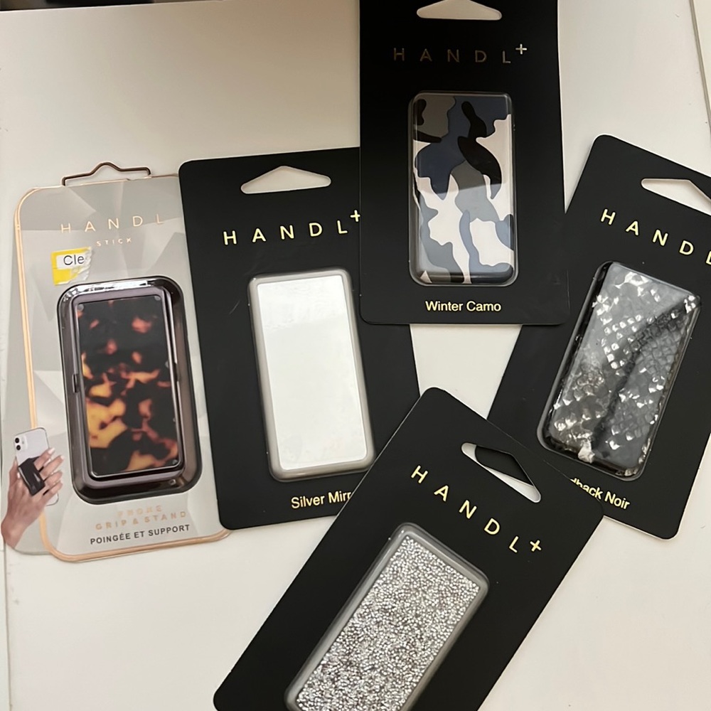 Handl phone grip and stand and four additional plates system covers